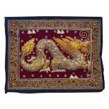 Oriental needlework panel depicting a Chinese dragon in metal thread, sequins etc, 46cm x 60cm,