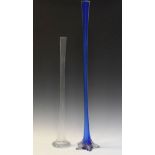 Two tall glass stem vases, the larger of pentagonal blue glass on spreading clear foot, 100cm