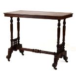 Late Victorian walnut occasional table of canted oblong form on ring turned twin end standards,
