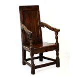 Late 17th/early 18th Century oak wainscot style open armchair having a panelled plain back between