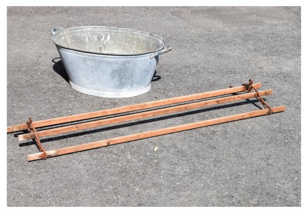 Early 20th Century galvanised tin bath of two handled oval form, together with a slatted four