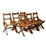 Set of six late Victorian pitch pine Gothic chairs having pierced trefoil back, hard seats raised on