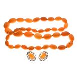 Graduated string of thirty-eight amber beads of varying colour and figure, together with a pair of
