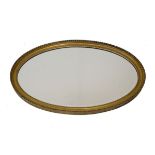 19th Century oval gilt framed wall mirror, 44cm x 74.5cm Condition: