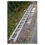 Pair of aluminium 13 rung step ladders, each of 3.9m length approximately, the two sections