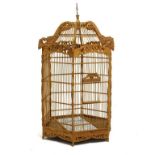 Large Oriental style birdcage of hexagonal design with domed roof, 79cm high excluding suspension