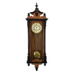 Late 19th Century walnut and ebonised Vienna style wall clock having carved crest Condition: