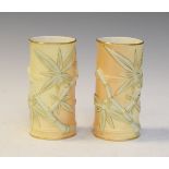 Pair of Royal Worcester cylindrical vases formed as bamboo stems in blush with gilt highlights