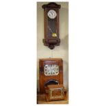 Three assorted clocks, comprising: 1920's oak wall clock, the octagonal Arabic dial marked Veritable