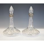 Pair of Elizabeth II silver mounted cut glass ships decanters, each with spire form stopper over