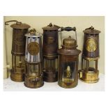 Five assorted miners and other safety lamps comprising: two examples by the Protector Lamp