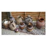 Group of assorted stoneware and other pottery jugs to include; two relief moulded examples of