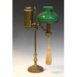 Late 19th Century brass reading lamp having green glass shade on adjustable column, circular foot,