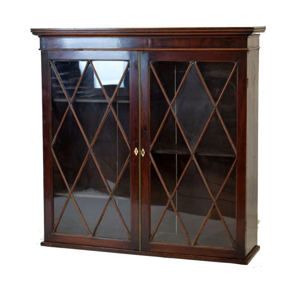 Early 19th Century mahogany bookcase, upper section only having a moulded cornice over a pair of