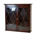 Early 19th Century mahogany bookcase, upper section only having a moulded cornice over a pair of