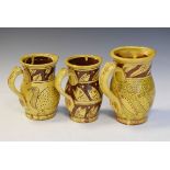 Studio Pottery - Three Jason Shackleton incised slipware decorated jugs, each bearing the J monogram