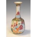 Famille Rose bottle shaped vase having hand painted decoration of seated figures in an interior, the