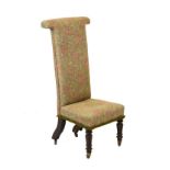 Victorian Prie-Dieu chair having a typical T shaped back and over stuffed seat on lappet carved