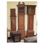 Group of late 18th/early 19th Century clock case parts comprising: mahogany crossbanded oak trunk