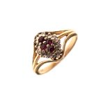 Dress ring set four ruby coloured stones in diamond surround, the shank stamped 14k, size K½