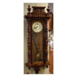 Late 19th Century beech and walnut cased Vienna style wall clock having ornate crest with turned