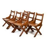 Set of six late Victorian pitch pine Gothic chairs having pierced trefoil back, hard seats raised on