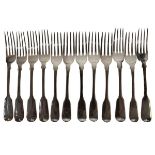 Twelve assorted early to mid 19th Century lunch forks, Fiddle pattern, various silver hallmarking