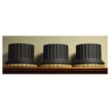 Set of three Wedgwood black basalt cylindrical planters from the Library Collection, each having