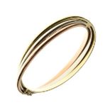 9ct three colour gold snap bangle, 18.5g approx Condition: