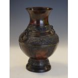 Chinese bronze baluster shaped vase decorated with dragons in relief, two ring drop handles