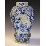 19th Century Delft ware baluster vase of octagonally facetted form decorated with a scroll edged