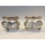 Pair of late 19th/early 20th Century Chinese export silver salts, each having embossed decoration