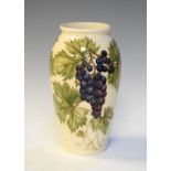 Modern Moorcroft Collectors Club vase decorated with the Grapevine pattern on a white ground, 18.5cm