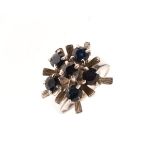 Contemporary style white metal ring set six blue stones, stamped 18k, size N, 5.6g approx Condition: