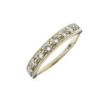 Yellow metal diamond set half eternity ring set nine stones, the shank stamped 18, size M Condition: