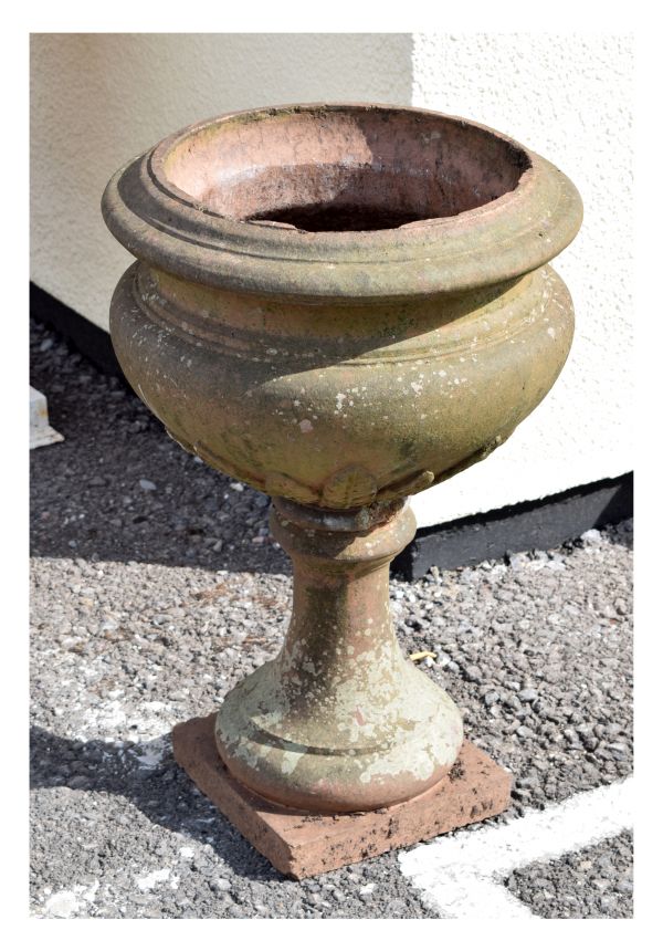 Antique terracotta coloured stoneware garden planter or urn of cauldron form with leaf decoration on