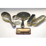 Edward VII/George V hammered silver mounted three piece brush set, London 1909/1915, a matching