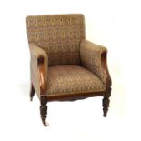 William IV/early Victorian walnut framed easy chair, the low overstuffed back between matching