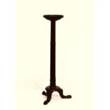 20th Century mahogany vase stand or torchère, the dished circular top on a six column cluster