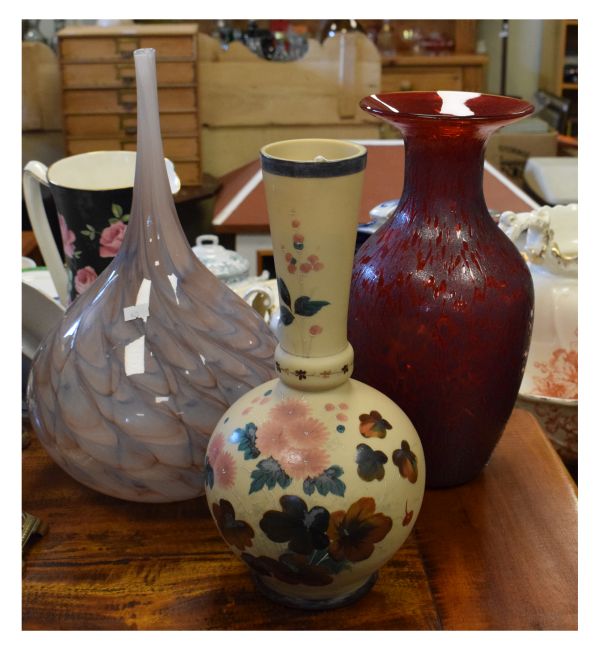 Three various glass vases comprising: a late 19th/early 20th Century milk glass example with painted