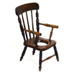 19th Century child's ash, elm and fruitwood commode armchair with turned uprights and open arms