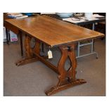 Early to mid 20th Century oak refectory table with rectangular top on two pierced trestle ends,