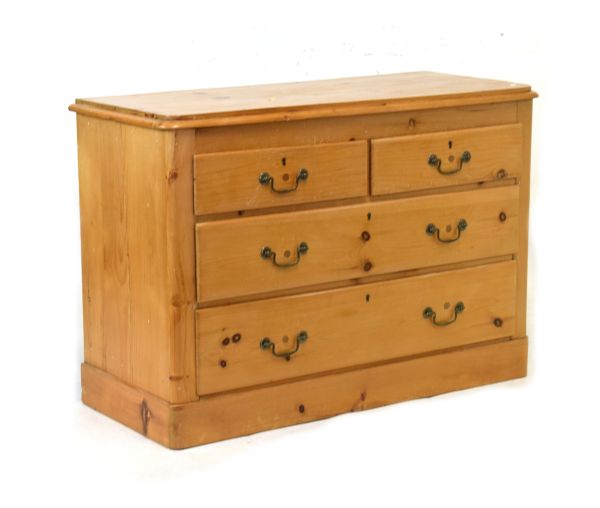 Pine chest of two short over two long drawers on plinth base Condition: