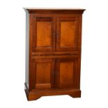 Reproduction yew wood tallboy or cabinet having two pairs of panelled cupboard doors enclosing