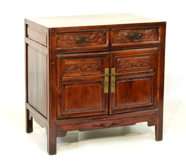 20th Century Chinese stained pine cabinet with cleated top over two drawers and two cupboard doors