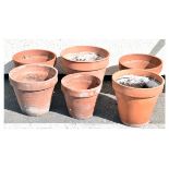 Six assorted terracotta coloured garden pots Condition: