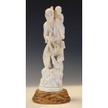 Japanese carved ivory okimono, circa 1900 formed as a man and two children Condition: