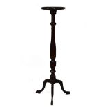 20th Century mahogany vase stand or torchère with dished circular top on fluted turned stem and
