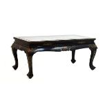 20th Century Oriental black lacquered coffee table, the rectangular top decorated in relief with