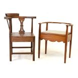 19th Century oak corner chair of 'smokers bow' design with panelled solid seat on square section